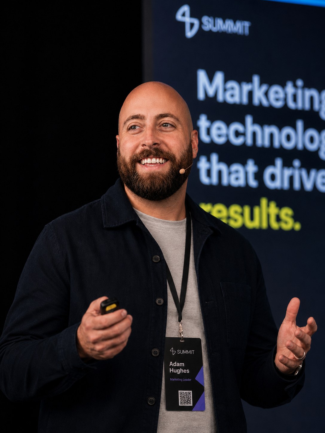 Adam Hughes speaking on stage at 4Ds Summit